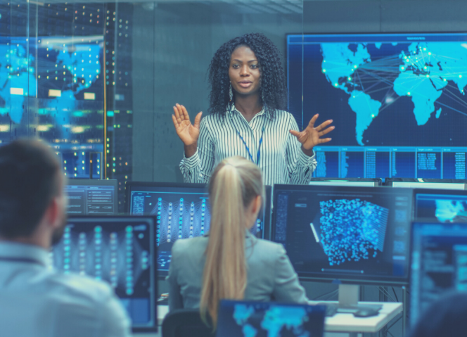 Woman presenting in computer lab cyber security courses